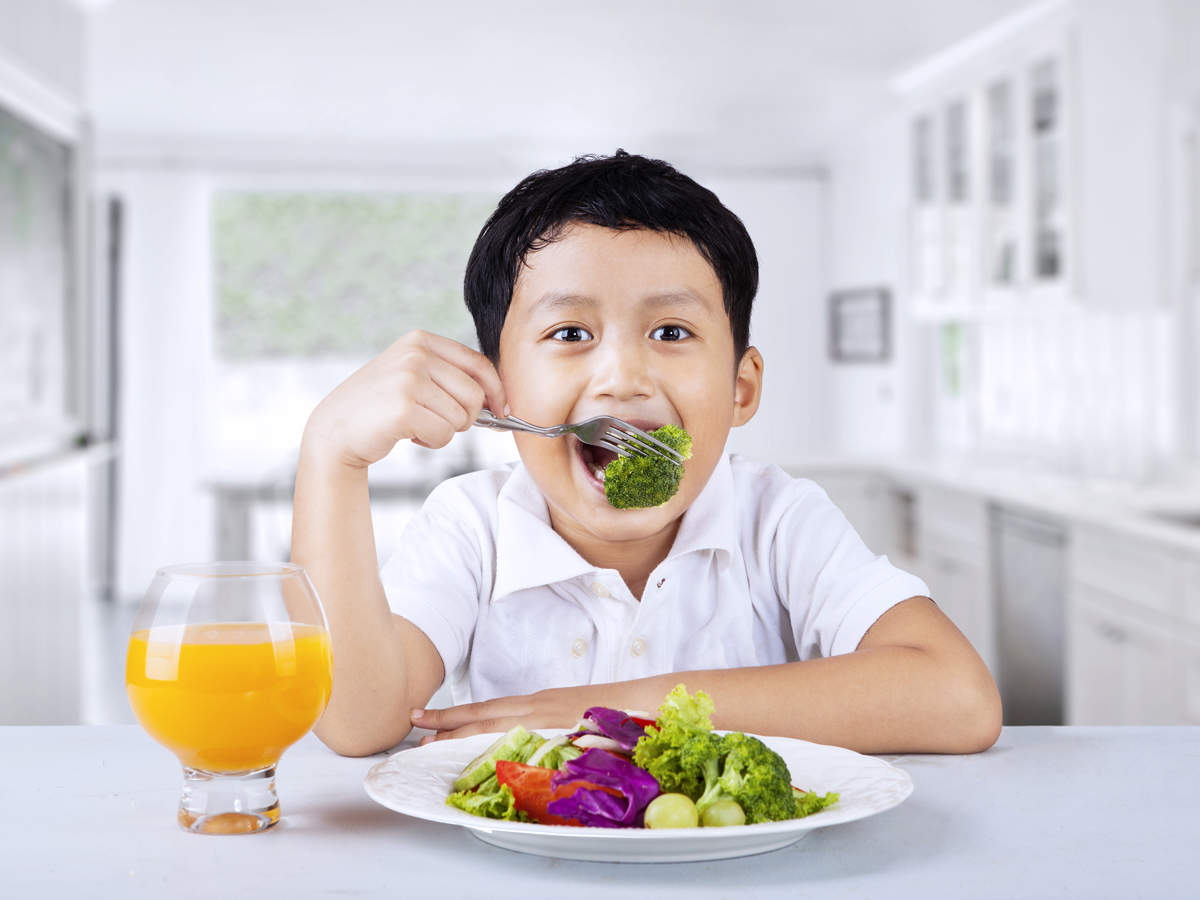 Kid Eating Broccoli Getty